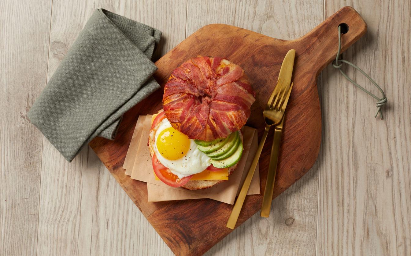 Bacon-wrapped breakfast bagel
